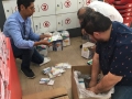 Renzo and store attendants packing bibles and tracts in Lima (photo kindness of Juanka and Renzo)
