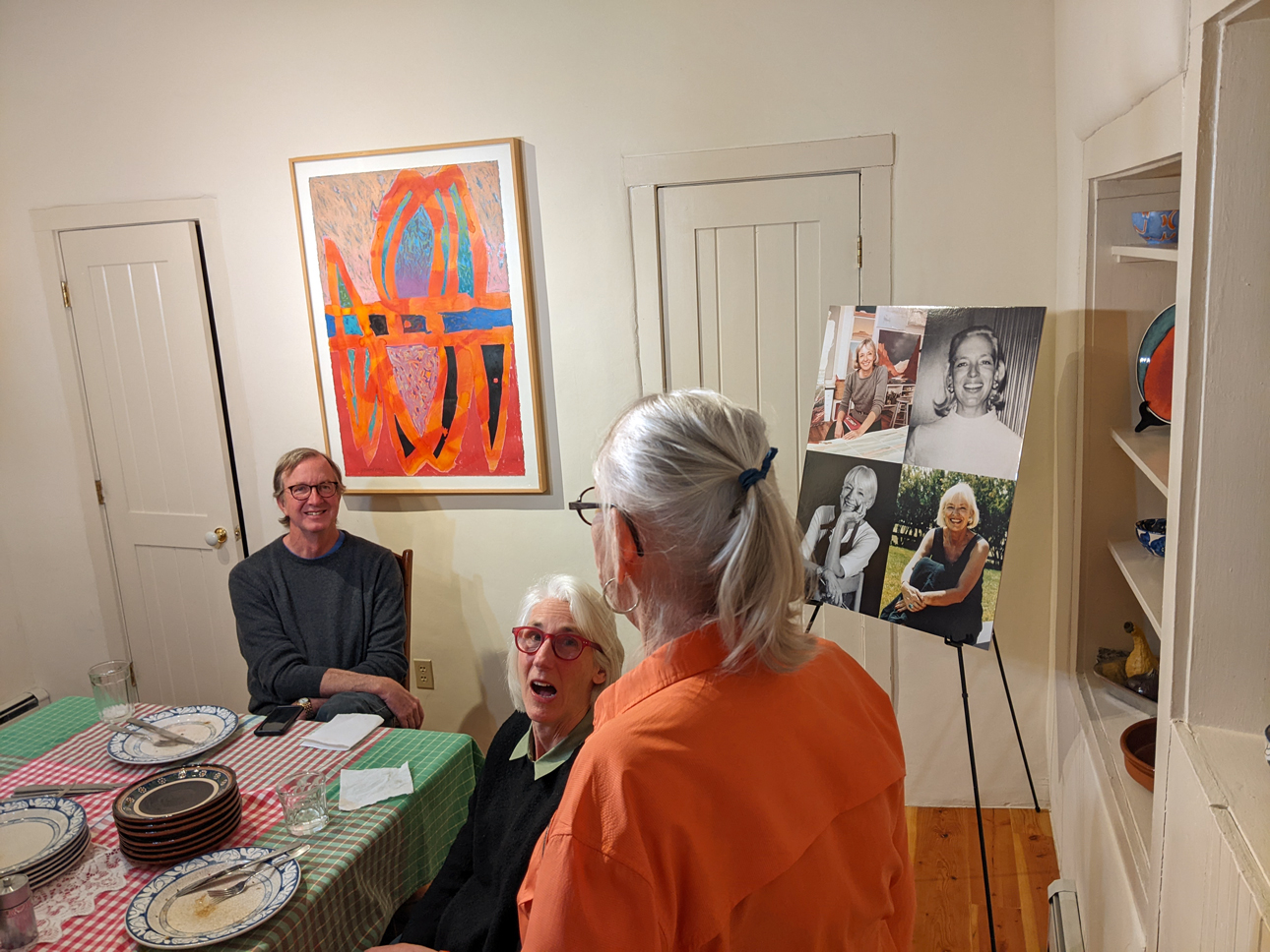 Celebratory dinner at 907 Canyon the next evening: Audrey, Jack, and his partner Dana Hawkes (from the dozen who attended); Mom portraits behind